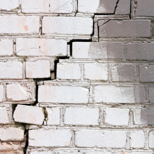 signs of foundation problems like cracks in walls and masonry 