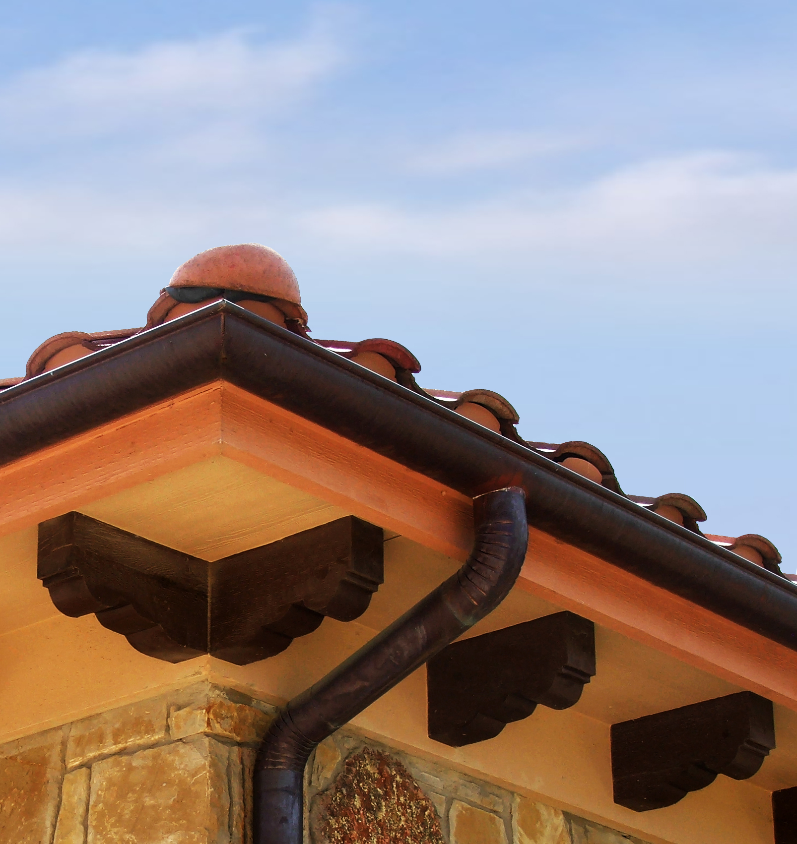 Halfround gutters with round downspouts and elbows